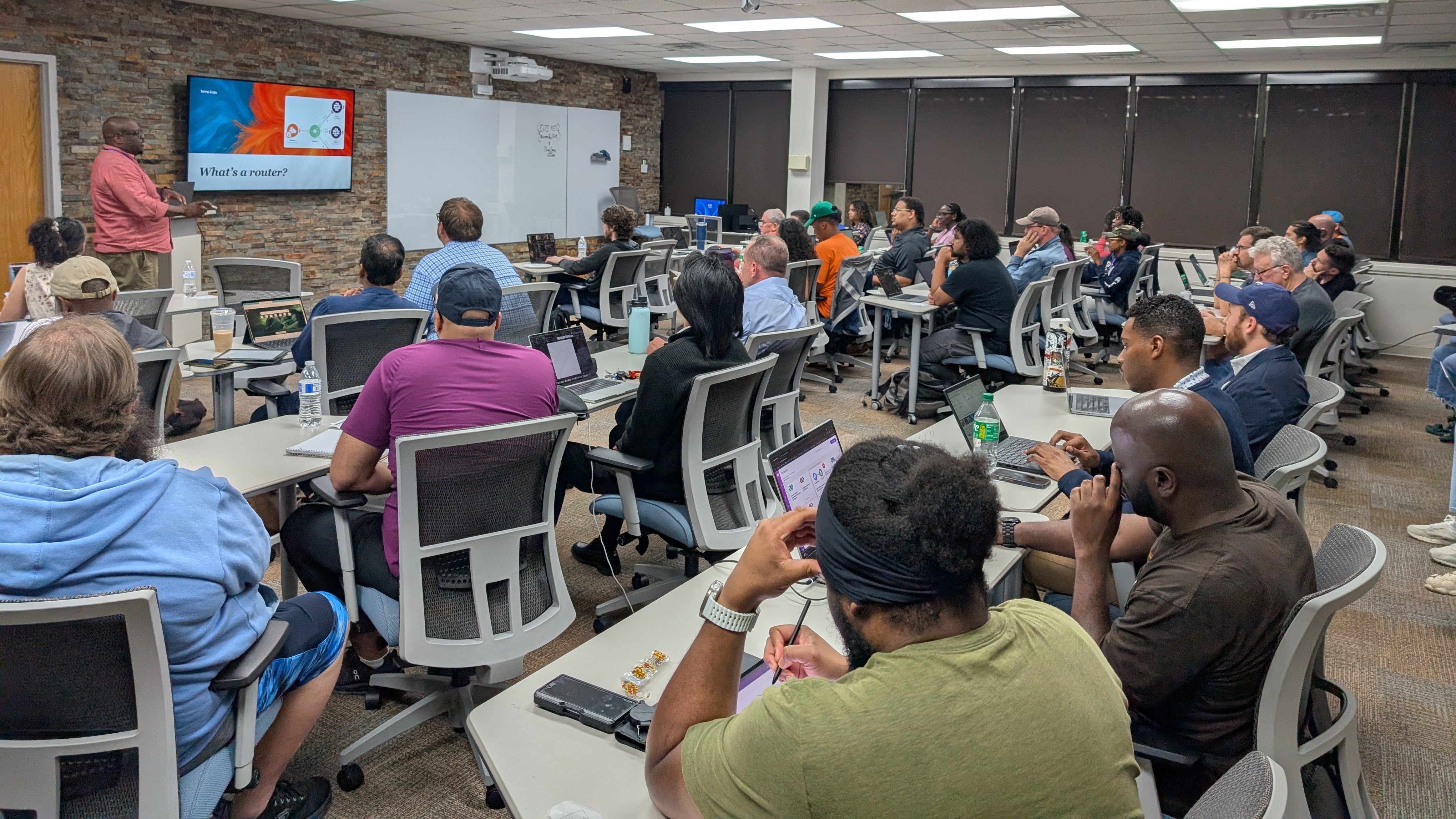A chapter workshop in session, attendees working at laptops